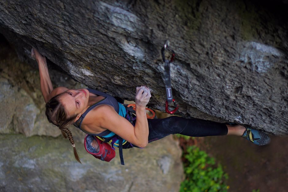 Chiara sticking the marginal heel-hook on New Orleans Heavy Weight Division (8c) in the Frankenjura. Photo by Christoph Hanke