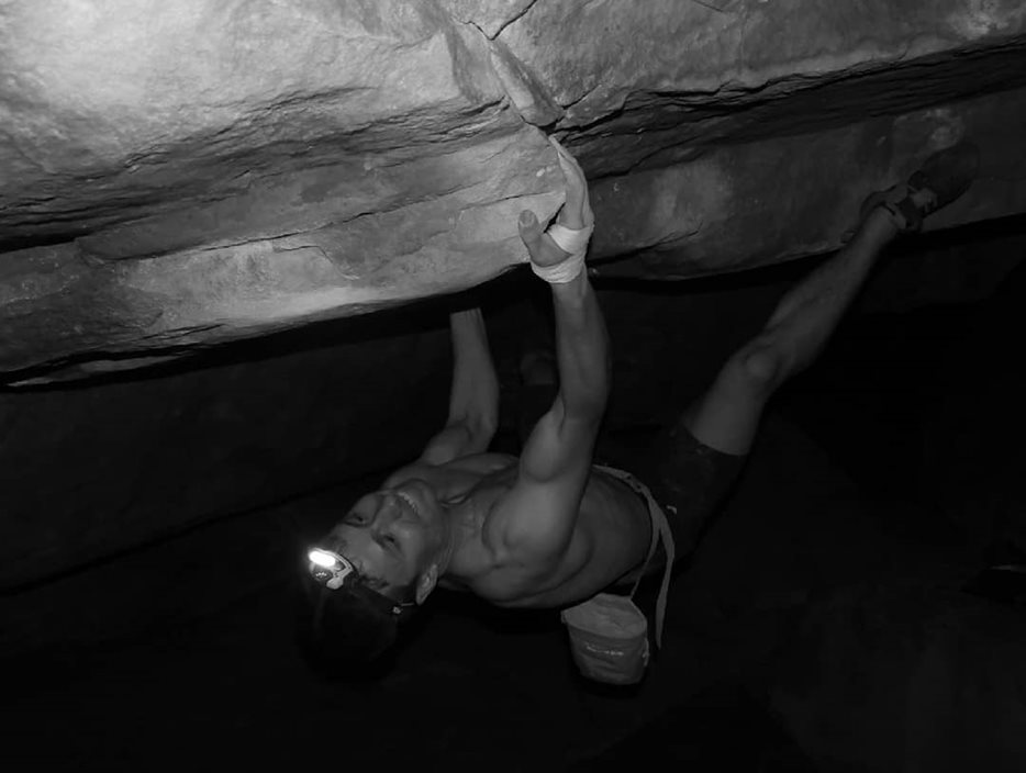 Calum cimbing Ghost in the Darkness 7c+, South Africa.
